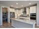 The kitchen features white cabinets and stainless steel appliances at 26421 W Zachary Dr, Buckeye, AZ 85396