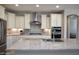 Bright kitchen features granite countertops, stainless steel appliances, and custom cabinetry at 26421 W Zachary Dr, Buckeye, AZ 85396