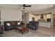 Open-concept living room leading into a kitchen with an island at 26421 W Zachary Dr, Buckeye, AZ 85396