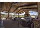 Inviting outdoor patio area with comfortable seating and golf course views at 26421 W Zachary Dr, Buckeye, AZ 85396