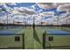 Multiple outdoor pickleball courts with new surfaces and lighting at 26421 W Zachary Dr, Buckeye, AZ 85396