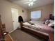 Inviting bedroom featuring a cozy bed, ample natural light, and closet for a relaxing retreat at 2729 W Keim Dr, Phoenix, AZ 85017