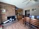Cozy dining area featuring a brick fireplace, wood table and chairs, creating a warm space for gatherings at 2729 W Keim Dr, Phoenix, AZ 85017