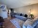 Inviting living room featuring a plush sectional sofa, neutral tones and a cozy rug, creating a relaxing atmosphere at 2729 W Keim Dr, Phoenix, AZ 85017