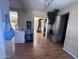 Spacious living room with wood-look floors, flowing layout, and potential for various furniture arrangements at 2729 W Keim Dr, Phoenix, AZ 85017