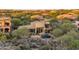 Aerial view of a luxury home with a pool nestled in a desert landscape at 29308 N 108Th N Pl, Scottsdale, AZ 85262