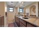 Spacious bathroom featuring double sinks, granite countertops, and a walk-in shower at 29308 N 108Th N Pl, Scottsdale, AZ 85262