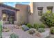 Desert home exterior with stone walkway and verdant succulent landscaping at 29308 N 108Th N Pl, Scottsdale, AZ 85262