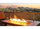 Cozy outdoor patio with a modern fire pit and picturesque views of the mountains at sunset at 29308 N 108Th N Pl, Scottsdale, AZ 85262
