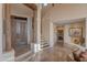 Grand foyer with a staircase and stylish lighting fixtures at 29308 N 108Th N Pl, Scottsdale, AZ 85262