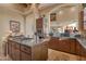 Gourmet kitchen featuring granite countertops, custom cabinetry, and stainless steel appliances at 29308 N 108Th N Pl, Scottsdale, AZ 85262