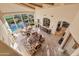 Spacious living room with a high ceiling, large windows, and an open floor plan leading to the dining area at 29308 N 108Th N Pl, Scottsdale, AZ 85262