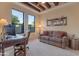 Bright office space with beamed ceiling, comfortable seating, and a large window with scenic views at 29308 N 108Th N Pl, Scottsdale, AZ 85262