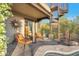 Outdoor patio featuring lounge chairs, a fire pit, a spiral staircase, and beautiful desert landscape at 29308 N 108Th N Pl, Scottsdale, AZ 85262