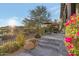 Beautiful outdoor patio with lush landscaping and comfortable seating area at 29308 N 108Th N Pl, Scottsdale, AZ 85262