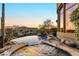 Beautiful infinity pool and spa at sunset featuring lush desert landscaping and a nearby patio at 29308 N 108Th N Pl, Scottsdale, AZ 85262