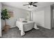 This bedroom features carpet flooring, bright natural light, a ceiling fan, and neutral paint at 2941 N Evergreen St, Buckeye, AZ 85396