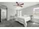 Bright bedroom with a ceiling fan, carpeted flooring, and neutral paint at 2941 N Evergreen St, Buckeye, AZ 85396
