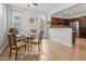 Bright dining area, neutral walls and light, and open view to modern kitchen at 2941 N Evergreen St, Buckeye, AZ 85396