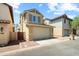 Home exterior features a two-car garage, and easy to maintain landscaping at 2941 N Evergreen St, Buckeye, AZ 85396