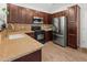 Well-lit kitchen featuring stainless steel appliances, tile backsplash, and granite countertops at 2941 N Evergreen St, Buckeye, AZ 85396