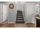 Carpeted stairway leading to the upper level, complemented by white walls and trim at 2941 N Evergreen St, Buckeye, AZ 85396