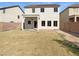 View of the house with covered patio and large backyard at 30271 W Crittenden Ln, Buckeye, AZ 85396