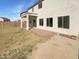 View of the house with covered patio and large backyard at 30271 W Crittenden Ln, Buckeye, AZ 85396