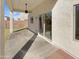 Covered back patio with concrete flooring and a ceiling fan overlooking a large backyard at 30271 W Crittenden Ln, Buckeye, AZ 85396