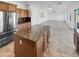 Spacious kitchen features granite countertops, stainless steel appliances, and an open layout at 30271 W Crittenden Ln, Buckeye, AZ 85396