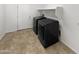 Bright laundry room features tile floors, modern appliances and a convenient shelf at 30271 W Crittenden Ln, Buckeye, AZ 85396