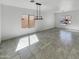 Living room showcasing neutral paint, recessed lighting, and tile floors at 30271 W Crittenden Ln, Buckeye, AZ 85396