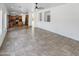 Open concept living room featuring tile floors connecting the kitchen and living spaces at 30271 W Crittenden Ln, Buckeye, AZ 85396