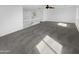 Upstairs loft features plush gray carpeting and natural light with stairs leading down to the main floor at 30271 W Crittenden Ln, Buckeye, AZ 85396