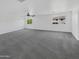 Upstairs loft features plush gray carpeting, bright natural light, and neutral walls at 30271 W Crittenden Ln, Buckeye, AZ 85396