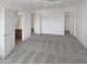 Spacious main bedroom with a ceiling fan, walk-in closet and access to the ensuite bathroom at 30271 W Crittenden Ln, Buckeye, AZ 85396