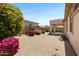 Backyard featuring a covered patio and low maintenance landscaping at 3531 N Sericin --, Mesa, AZ 85215