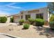 A well-maintained single Gathering home with desert landscaping, rocks, and green bushes in the front yard at 3531 N Sericin --, Mesa, AZ 85215