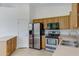 Kitchen featuring stainless steel appliances, light wood cabinets and tile flooring at 3531 N Sericin --, Mesa, AZ 85215