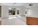 Living room showcasing high ceilings, large windows with outdoor views, and a combination of tile and carpet flooring at 3531 N Sericin --, Mesa, AZ 85215