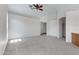 Open-concept living room featuring neutral carpet, vaulted ceilings, and ample natural light at 3531 N Sericin --, Mesa, AZ 85215