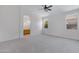 Large main bedroom with neutral carpet, a ceiling fan, bright windows and an en-suite bathroom at 3531 N Sericin --, Mesa, AZ 85215