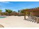 Community pool area with tables and chairs surrounding the pool at 3531 N Sericin --, Mesa, AZ 85215