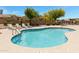 Community pool with lounge chairs surrounding it at 3531 N Sericin --, Mesa, AZ 85215