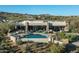Wide aerial view featuring a desert oasis with a sparkling pool and desert landscape at 41611 N 113Th Pl, Scottsdale, AZ 85262