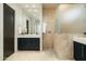 Beautiful bathroom featuring tiled flooring, shower with glass enclosure and sleek vanity at 41611 N 113Th Pl, Scottsdale, AZ 85262