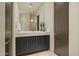 Elegant bathroom featuring a modern vanity, a large mirror, and a separate shower room at 41611 N 113Th Pl, Scottsdale, AZ 85262