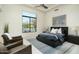 Spacious bedroom featuring a king bed, stylish rug, and a large window with a view at 41611 N 113Th Pl, Scottsdale, AZ 85262