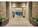 Grand entryway featuring a glass door leading into the light-filled living room at 41611 N 113Th Pl, Scottsdale, AZ 85262