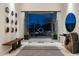 Spacious entryway boasts modern decor, glass doors, and views to the outdoor space at 41611 N 113Th Pl, Scottsdale, AZ 85262